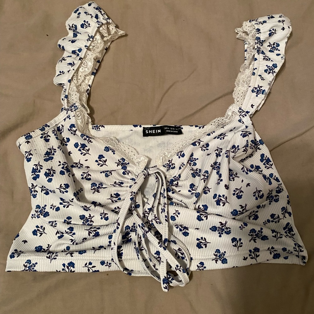white cropped tank top with blue flowers all over